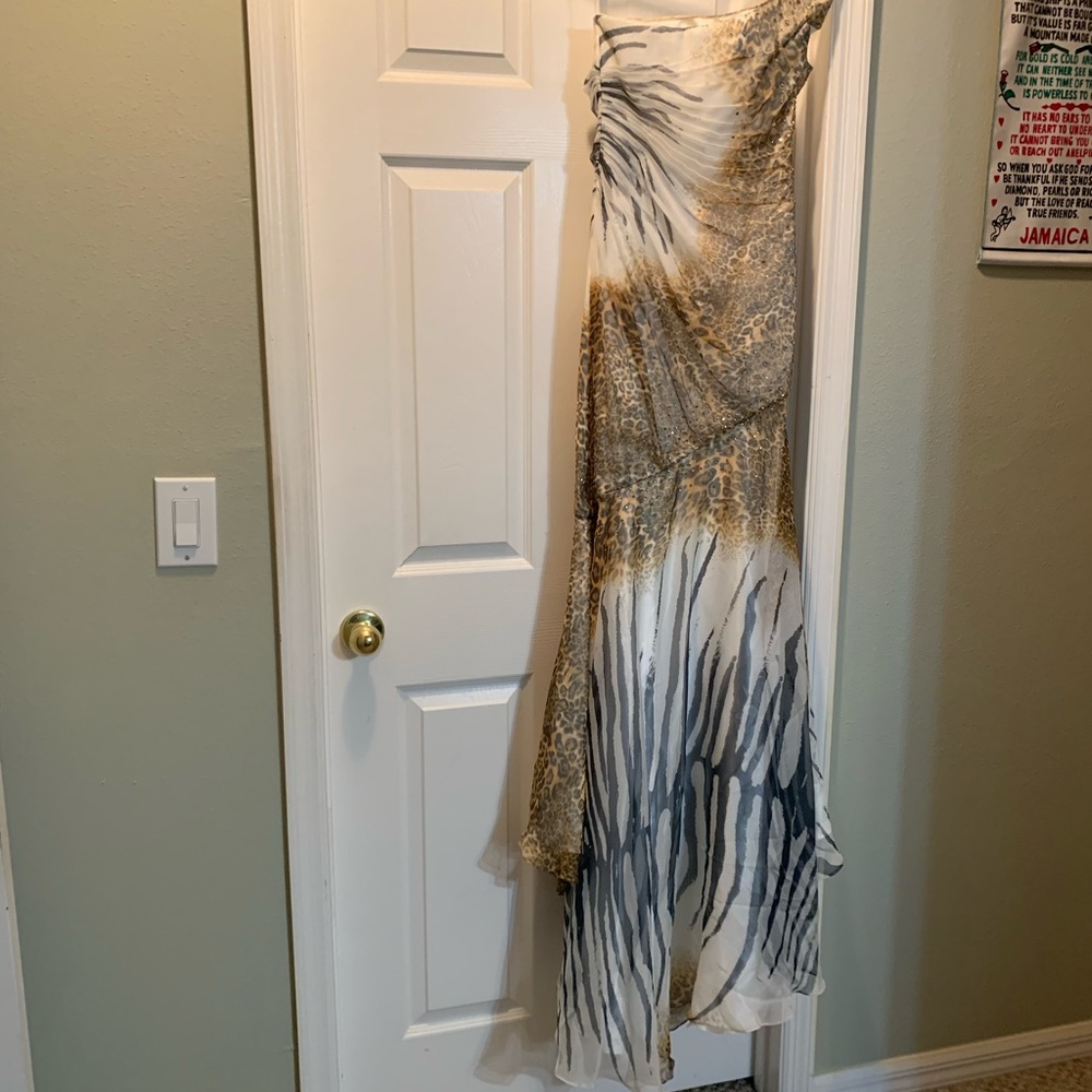 One shoulder gown with small trail in the back.